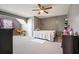 Bedroom with gray walls, a ceiling fan, neutral carpet, and furnishings for restful living at 102 Crescent Woode Way, Dallas, GA 30157