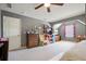 Bedroom with gray walls, a ceiling fan, neutral carpet, and furnishings for restful living at 102 Crescent Woode Way, Dallas, GA 30157