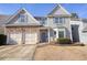 Charming home with stone accents, a two car garage, neat lawn, and blue shutters accenting the windows at 102 Crescent Woode Way, Dallas, GA 30157