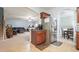Open kitchen flows to living and dining spaces, with cherry cabinets, tile floors and stainless appliances at 102 Crescent Woode Way, Dallas, GA 30157