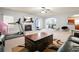 Open-concept living room with a fireplace, modern furniture, and seamless transition to the kitchen at 102 Crescent Woode Way, Dallas, GA 30157