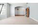 Spacious area with plush neutral carpeting, and a large archway to the entryway at 102 Crescent Woode Way, Dallas, GA 30157