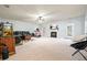 Expansive living room featuring plush carpeting, a cozy fireplace, and ample natural light at 102 Crescent Woode Way, Dallas, GA 30157