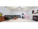 Bright living room with a fireplace, television, leather sofa, ceiling fan and neutral carpet at 102 Crescent Woode Way, Dallas, GA 30157
