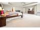 Bright main bedroom boasts tray ceiling, large windows, and ample space for relaxation at 102 Crescent Woode Way, Dallas, GA 30157