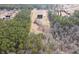 Aerial view of the home, nestled on a large lot surrounded by lush green trees and foliage at 172 Lakeview Dr, Newborn, GA 30056