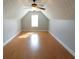 Attic with vaulted ceilings, a single window, and wood-look floors at 172 Lakeview Dr, Newborn, GA 30056