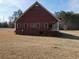 Rear view of the home's exterior showcasing the design and structure along with the backyard at 172 Lakeview Dr, Newborn, GA 30056