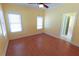 Bright, spacious bedroom with two windows and light yellow walls at 172 Lakeview Dr, Newborn, GA 30056