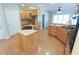 Well-lit kitchen with island, wooden cabinetry, and modern appliances at 172 Lakeview Dr, Newborn, GA 30056