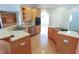 Open kitchen with stainless steel appliances, cabinetry, and large countertops at 172 Lakeview Dr, Newborn, GA 30056
