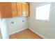Laundry room with ample storage space and a bright window at 172 Lakeview Dr, Newborn, GA 30056