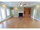 Spacious living room with fireplace, built-ins, and lots of light at 172 Lakeview Dr, Newborn, GA 30056