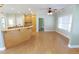 Bright living room with breakfast bar, lots of light, and wood floors at 172 Lakeview Dr, Newborn, GA 30056