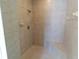 Tiled shower with built-in bench and shower head at 172 Lakeview Dr, Newborn, GA 30056