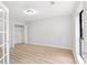 Bright bedroom with wood-look floors, closet, and a window providing natural light at 3110 Pine Heights Ne Dr, Atlanta, GA 30324