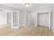 Bedroom with wood-look floors and large closet with open door at 3110 Pine Heights Ne Dr, Atlanta, GA 30324
