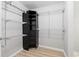 Walk-in closet featuring shelving, drawers, and hanging rods for ample storage at 3110 Pine Heights Ne Dr, Atlanta, GA 30324