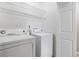 Laundry room featuring a washing machine and dryer with shelving above at 3110 Pine Heights Ne Dr, Atlanta, GA 30324