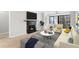 Inviting living room features a cozy fireplace, stylish furnishings, and serene views from sliding glass doors at 3110 Pine Heights Ne Dr, Atlanta, GA 30324