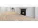 Open concept living room showcasing fireplace and view of the kitchen with bar seating at 3110 Pine Heights Ne Dr, Atlanta, GA 30324