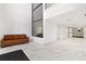 Spacious lobby with marble floors, a brown leather sofa, and modern design at 3110 Pine Heights Ne Dr, Atlanta, GA 30324