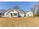Charming single-story home with a well-maintained lawn, pergola and freshly painted white exterior at 505 Cochran Dr, Norcross, GA 30071