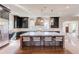 Bright kitchen featuring a large island, marble countertops, stainless steel appliances, and dark cabinets at 505 Cochran Dr, Norcross, GA 30071