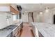 Contemporary kitchen featuring a large island with marble countertops and stainless steel appliances at 505 Cochran Dr, Norcross, GA 30071