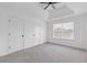 Bright bedroom with soft gray carpet, tray ceiling and natural light at 5563 Hosea Ct, Ellenwood, GA 30294