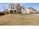 Well-kept two-story home with vinyl siding and brick accents, featuring a manicured front lawn at 5563 Hosea Ct, Ellenwood, GA 30294