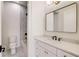 Modern bathroom featuring a stylish mirror and a tub with decorative tile at 244 Brooke Dr, Alpharetta, GA 30009