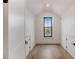 Hallway with hardwood floors, window and white doors at 244 Brooke Dr, Alpharetta, GA 30009