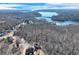 Aerial view highlighting the home's lake view and established neighborhood at 6225 Leeward Tide Ct, Cumming, GA 30041