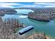 Aerial view of the lake and the surrounding landscape at 6225 Leeward Tide Ct, Cumming, GA 30041