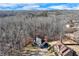 Aerial view of a home surrounded by a forest at 6225 Leeward Tide Ct, Cumming, GA 30041