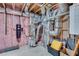 Unfinished basement utility area showcasing HVAC, plumbing, and mechanical systems at 6225 Leeward Tide Ct, Cumming, GA 30041