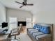 Relaxing bedroom with a rustic desk and daybed in a light-filled space with a vaulted ceiling at 6225 Leeward Tide Ct, Cumming, GA 30041