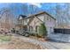 Well-maintained two-story home with lush landscaping, a covered porch, and three car garage at 6225 Leeward Tide Ct, Cumming, GA 30041