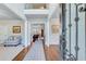 Elegant foyer featuring hardwood floors, high ceilings, and an open view to the living spaces at 6225 Leeward Tide Ct, Cumming, GA 30041