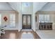 Grand foyer showcasing elegant double doors, high ceilings, and access to the dining and living rooms at 6225 Leeward Tide Ct, Cumming, GA 30041
