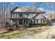 Well-maintained two-story home featuring great curb appeal and mature trees at 6225 Leeward Tide Ct, Cumming, GA 30041
