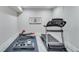 Home gym with weight training equipment and rubber flooring at 6225 Leeward Tide Ct, Cumming, GA 30041