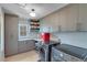 Well-organized laundry room featuring ample cabinet space, modern appliances, and a bright window at 6225 Leeward Tide Ct, Cumming, GA 30041
