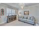 Cozy living room featuring a comfortable sofa, stylish console table, and a decorative light fixture at 6225 Leeward Tide Ct, Cumming, GA 30041
