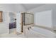 Luxurious main bathroom features a soaking tub, glass enclosed shower and access to the main bedroom at 6225 Leeward Tide Ct, Cumming, GA 30041