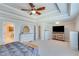 Open main bedroom boasts trey ceiling, fan, and ensuite bathroom; plenty of closet space at 6225 Leeward Tide Ct, Cumming, GA 30041