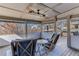 Relaxing screened porch with comfortable seating and a ceiling fan at 6225 Leeward Tide Ct, Cumming, GA 30041