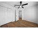 A bedroom with wood-look floors, neutral walls and a ceiling fan at 780 Gardenside Se Cir, Marietta, GA 30067