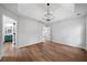 Bright bedroom boasts a tray ceiling with modern lighting and wood-look flooring at 780 Gardenside Se Cir, Marietta, GA 30067